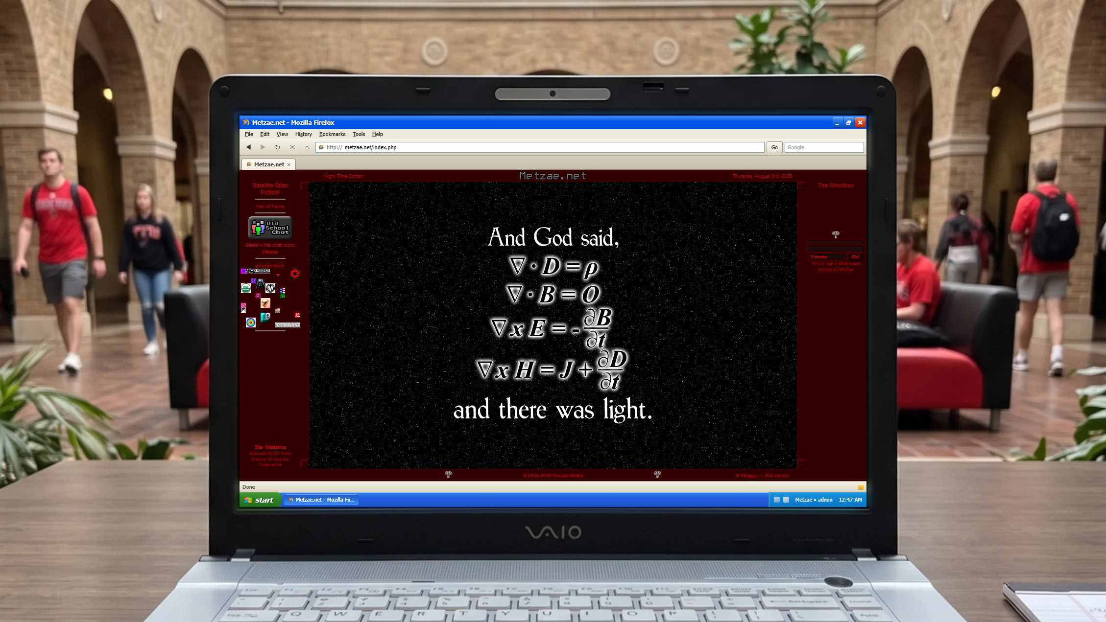 Laptop screen showing biblical text in a public setting with people around.