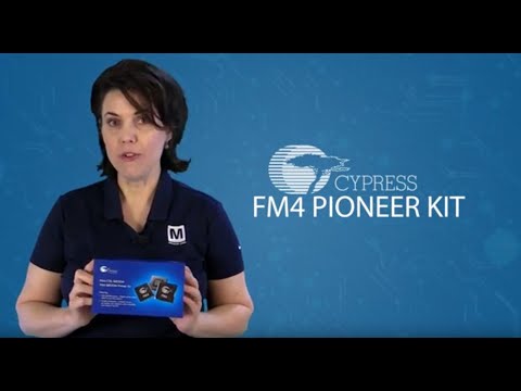Woman holding Cypress FM4 Pioneer Kit box for electronics projects.